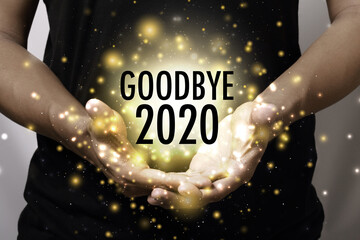 Goodbye 2020 with hand.