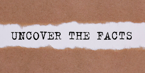 Uncover The Facts word written behind torn paper.