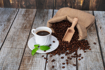Coffee beans and coffee cup with coffee,old bag