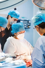 Mexican surgeon performing surgery with her medic team