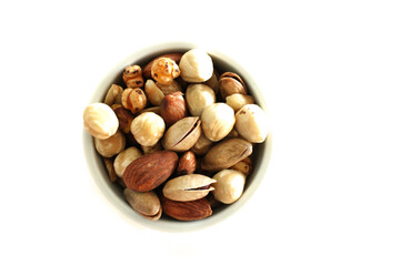 Mixed nuts and dry fruits, white background, top view