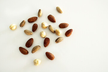 Mixed nuts and dry fruits on white background