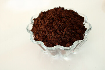 Ground coffee in a glass bowl