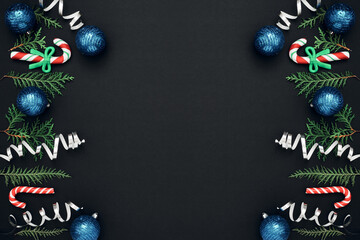 New Year's, festive decor on a black background. Copy space, flat lay, mock up, top view.