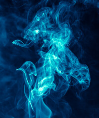 Fototapeta na wymiar Blue smoke isolated on black background.