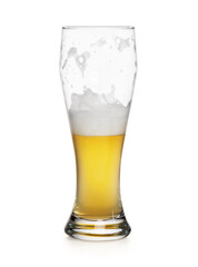 half empty glass of a light lager beer isolated