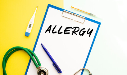 Text ALLERGY on a letterhead in a medical folder on a colorful background..