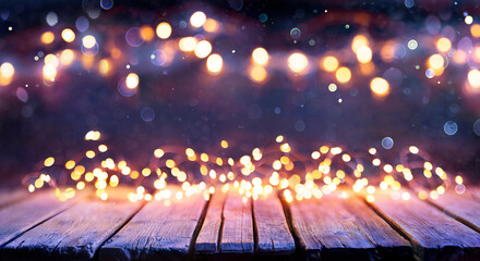 Abstract Christmas Background - Wooden Table With Defocused String Lights