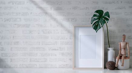 Mockup blank wooden picture frame on white table with brick wall.