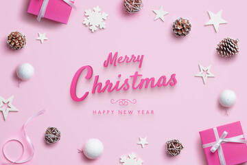 Fototapeta na wymiar Merry Christmas and Happy New Year greeting card with Christmas decorations on pink pastel surface. Top view, flat lay