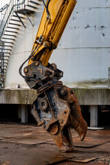hydraulic shears on an excavator ready to start demolishing and cutting sheet metal