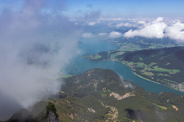 Looking through the clouds at the Mondsee, seen from the Schafberg