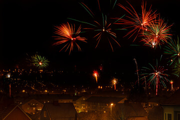 Fireworks show over a city at new years eve