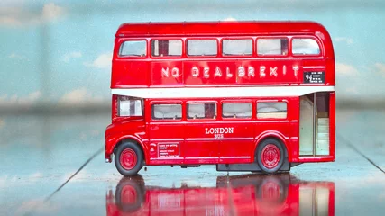 Fotobehang little brexit bus with a message no deal ,sky,clouds © charles taylor