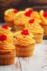 Cupcakes with orange icing on top