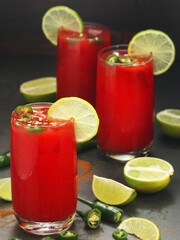 Jalapeno tomato margarita cocktail with lime	