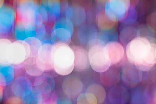 Abstract colorful background with bokeh defocused lights.