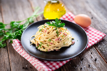 Spaghetti alla carbonara. Pasta with pancetta, egg, parmesan cheese and cream sauce. 