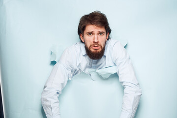 A man gestures with his hands in the shirt of an office manager official working