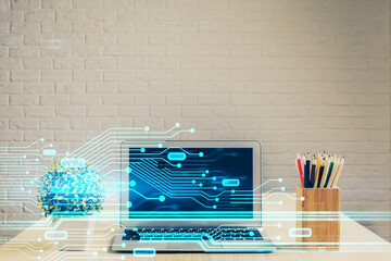 Double exposure of table with computer on background and data theme hologram. Data technology concept.