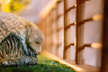 statue of a person sheep