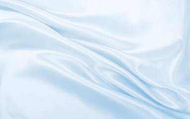 Smooth elegant blue silk or satin luxury cloth texture as abstract background. Luxurious background design