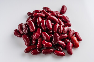canned red kidney beans on a white acrylic background