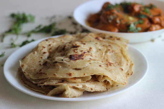 Homemade Malabar parotta with butter chicken