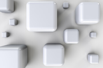 Polished rounded white cubes of different sizes on the floor. Top view