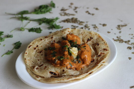 Homemade Malabar parotta with butter chicken
