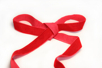 Red ribbon close-up on a white background