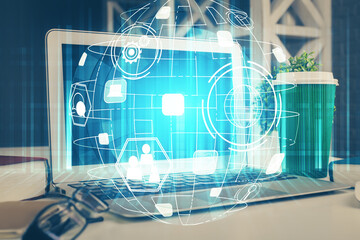Computer on desktop with social network hologram. Multi exposure. Concept of international people...