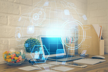 Computer on desktop with social network hologram. Multi exposure. Concept of international people connections.