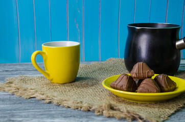 Still life with coffee beans on the wooden background