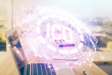 Double exposure of blockchain theme hologram and table with computer background. Concept of bitcoin crypto currency.