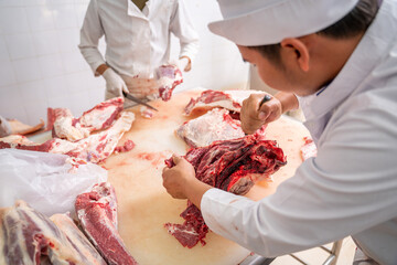 Asian butcher cut raw meat wagyu beef with a knife at the slaughterhouse, Meat industry, Wagyu Beef