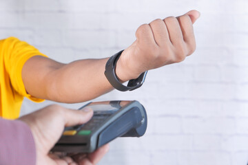 Payment terminal charging from a smart watch , contactless payment.