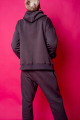 parts of hoodie clothing on a multicolored background dressed on men