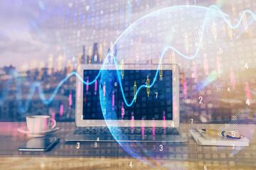 Financial graph colorful drawing and table with computer on background. Double exposure. Concept of...