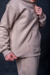 parts of hoodie clothing on men on a colored background