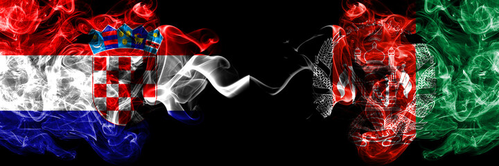 Croatia, Croatian vs Afghanistan, Afghan smoky mystic flags placed side by side. Thick colored silky abstract smoke flags.