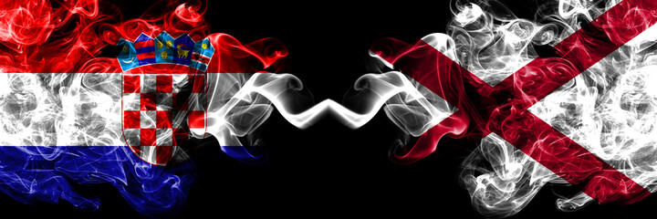Croatia, Croatian vs Alabama, Alabamian smoky mystic flags placed side by side. Thick colored silky abstract smoke flags.