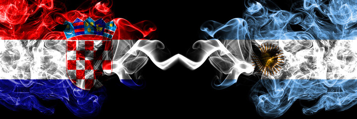 Croatia, Croatian vs Argentina, Argentinian, Argentine smoky mystic flags placed side by side. Thick colored silky abstract smoke flags.