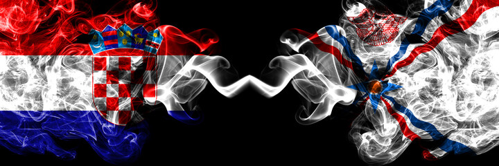 Croatia, Croatian vs Assyria smoky mystic flags placed side by side. Thick colored silky abstract smoke flags.
