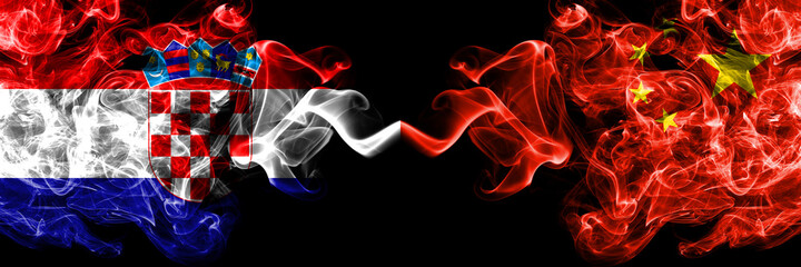 Croatia, Croatian vs China, Chinese smoky mystic flags placed side by side. Thick colored silky abstract smoke flags.