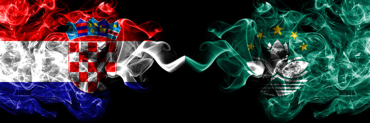 Croatia, Croatian vs Macau, China, Chinese smoky mystic flags placed side by side. Thick colored silky abstract smoke flags.