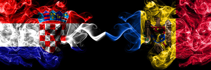 Croatia, Croatian vs Moldova, Moldovan smoky mystic flags placed side by side. Thick colored silky abstract smoke flags.