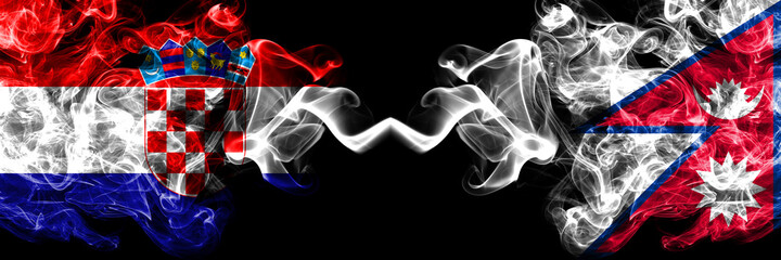 Croatia, Croatian vs Nepal, Nepali, Nepalese smoky mystic flags placed side by side. Thick colored silky abstract smoke flags.