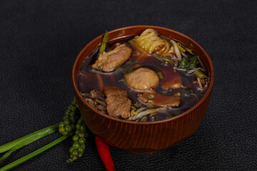 Thai style soup with meat and mushrooms