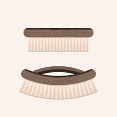 Wooden brush for hair or clothes isolated on beige background. ECO friendly concept.